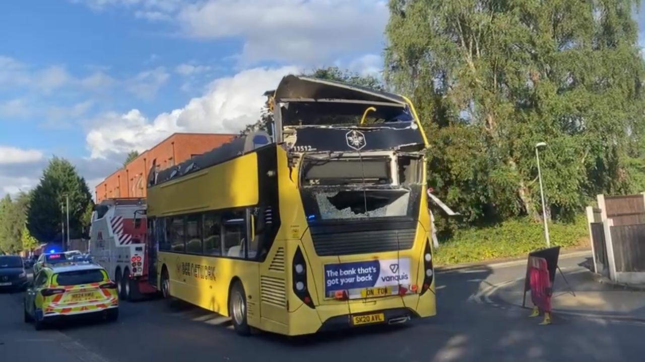 Bus driver arrested after 20 people injured in bridge collision